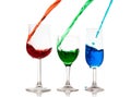 Colorful liquid pouring into glasses Royalty Free Stock Photo