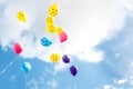 Colorful little balloon flying in blue sky