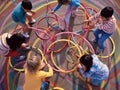 Children playing with hula hoops and jump ropes