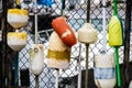 Colorful Lobster Buoys on Fence Royalty Free Stock Photo