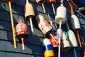 Colorful lobster buoys hang on a wall of a seafood restaurant Royalty Free Stock Photo