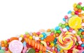 Colorful lollipops and different colored round candy isolated Royalty Free Stock Photo