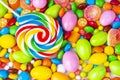 Colorful lollipops and different colored round candy. Top view Royalty Free Stock Photo