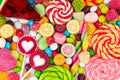 Colorful lollipops and different colored round candy. Royalty Free Stock Photo