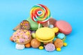 Colorful lollipops and different colored round candy. Top view Royalty Free Stock Photo