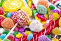 Colorful lollipops and different colored round candy. Top view Royalty Free Stock Photo
