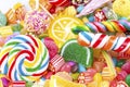 Colorful lollipops and different colored round candy. Top view Royalty Free Stock Photo