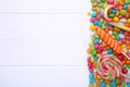 Colorful lollipops and different colored round candy on white background Royalty Free Stock Photo