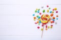 Colorful lollipops and different colored round candy on white background Royalty Free Stock Photo