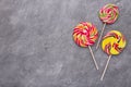 Colorful lollipops on grey concrete background. Sweets Royalty Free Stock Photo