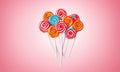 Colorful lollipops on pink background. 3d rendering