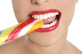 Colorful Lollypop in perfect woman teeth