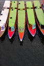 Colorful long boats vertical