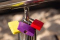 Colorful love locks on a handrail