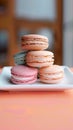 Colorful macaron cookies displayed on square plate stand attractively