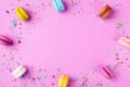 Colorful macaron or macaroon on pink punchy background top view. Flat lay style Royalty Free Stock Photo