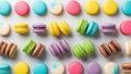 Colorful macarons are arranged in rows on a white background Royalty Free Stock Photo