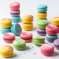 Colorful macarons arranged in stacks on a white surface create a vibrant Royalty Free Stock Photo