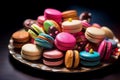 Colorful Macarons on Bright Plate Against Dark Background