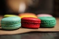 Colorful macarons cake. Closeup macaroons on color white isolated background. in coffee shop vintage color. Wooden table Royalty Free Stock Photo