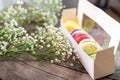 Colorful macarons cakes. Small French cakes on the wooden background. Royalty Free Stock Photo