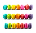 Colorful macarons collection on white background, side view