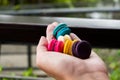 Colorful macarons on hand ,French Macaroons dessert