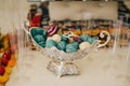 Colorful macarons on pyramid-shaped plastic tower stand as part of candy bar sweet table Royalty Free Stock Photo