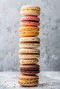 Colorful Macarons Stacked in a Tower on a Marble Background