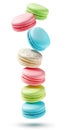 Colorful macaroon cookies flying over white background. Generative AI realistic illustration