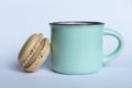 Colorful macaroon and cup of coffee on white background. Royalty Free Stock Photo
