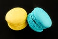Colorful macaroon over black.