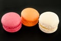 Colorful macaroon over black.
