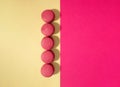 Colorful macaroons cakes on pink background. Flat lay Royalty Free Stock Photo