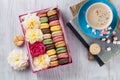 Colorful macaroons, coffee. Sweet macarons