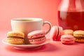 Colorful Macaroons Dessert on White Plate and Tea Coffee on Blur Pink Background