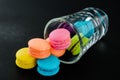 Colorful macaroons in glass.