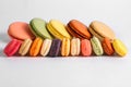 Colorful big and small macaroons isolated on white background