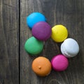 Colorful macaroons on wooden background