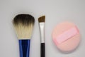 Colorful make-up tools on a white background. Beauty supplies.
