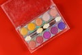 Colorful makeup palette, eye shadow in clear box Royalty Free Stock Photo
