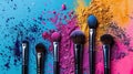 Colorful makeup powder and brushes on blue background. Royalty Free Stock Photo