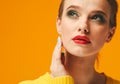 Colorful makeup woman red lips in yellow clothes on color happy summer fashion background manicured nails Royalty Free Stock Photo