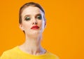 Colorful makeup woman red lips in yellow clothes on color happy summer fashion background manicured nails Royalty Free Stock Photo