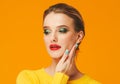 Colorful makeup woman red lips in yellow clothes on color happy summer fashion background manicured nails Royalty Free Stock Photo