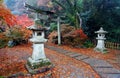 Colorful maple trees & fallen leaves at the entrance to Benzaiten Shrine in Bishamon-do Buddhist Temple Royalty Free Stock Photo