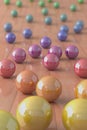 Colorful marble balls on a parquet floor