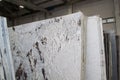 Colorful marble slabs in store show room. Granite slabs are prepared for sale in store yard