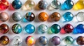 Colorful Marbles Collection: Playful Patterns on Light Blue Surface Royalty Free Stock Photo
