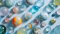 Colorful Marbles Collection: Playful Patterns on Light Blue Surface Royalty Free Stock Photo